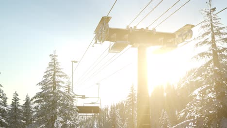 empty-ski-lift.-chairlift-silhouette-on-high-mountain-over-the-forest-at-sunset